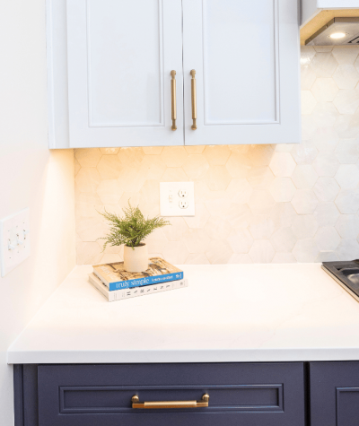 White Quartz Kitchen Counter with zellige tile backsplash